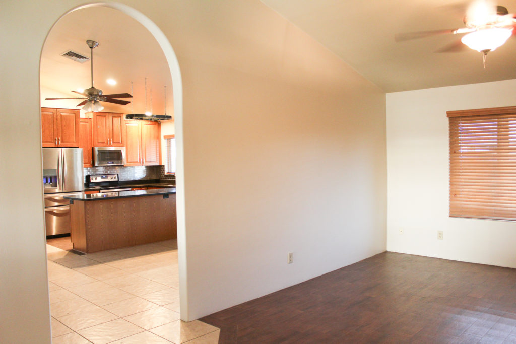 before and after farmhouse kitchen remodel white cabinets black granite counters white subway tile 13