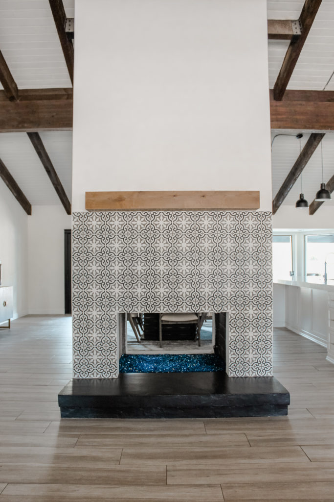 modern farmhouse blue patterned tile fireplace black hearth natural wood floating mantle