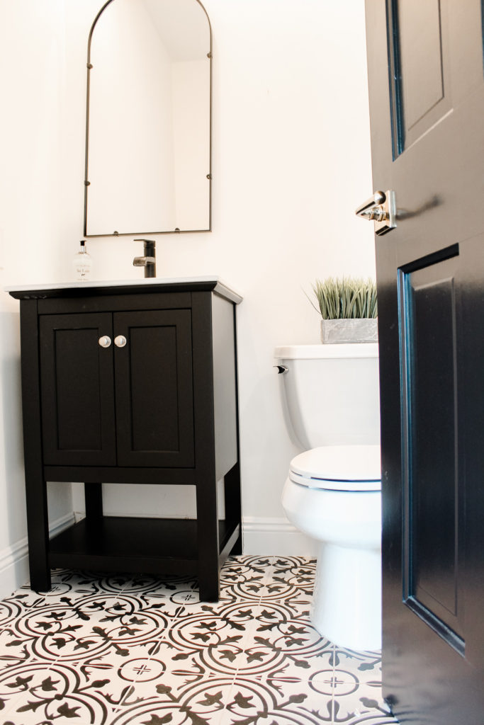 modern farmhouse bathroom black and white patterned tiles