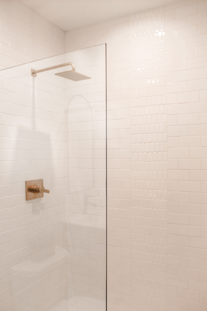 modern farmhouse bathroom white subway tile shower brushed gold hardware
