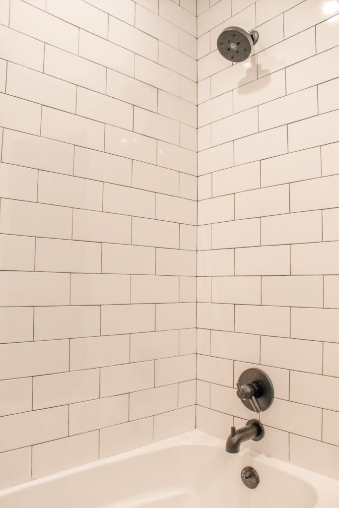 modern farmhouse subway tile shower with black matte hardware