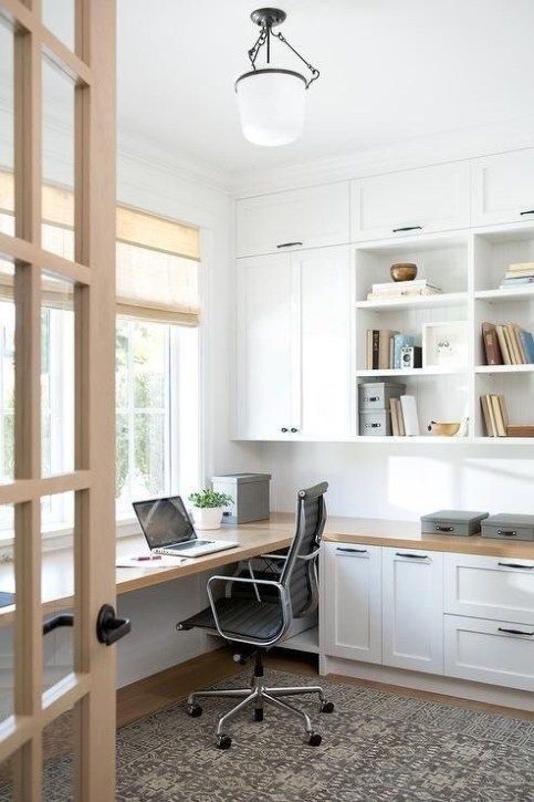 white built in desk with cabinets